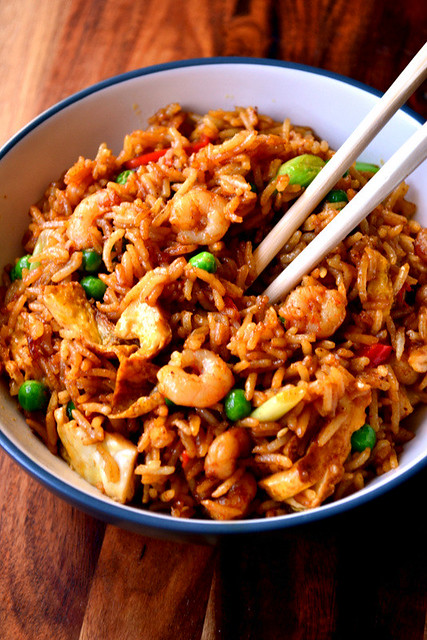 A bowl with rice and prawns